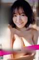 a japanese woman in a bikini posing for the camera